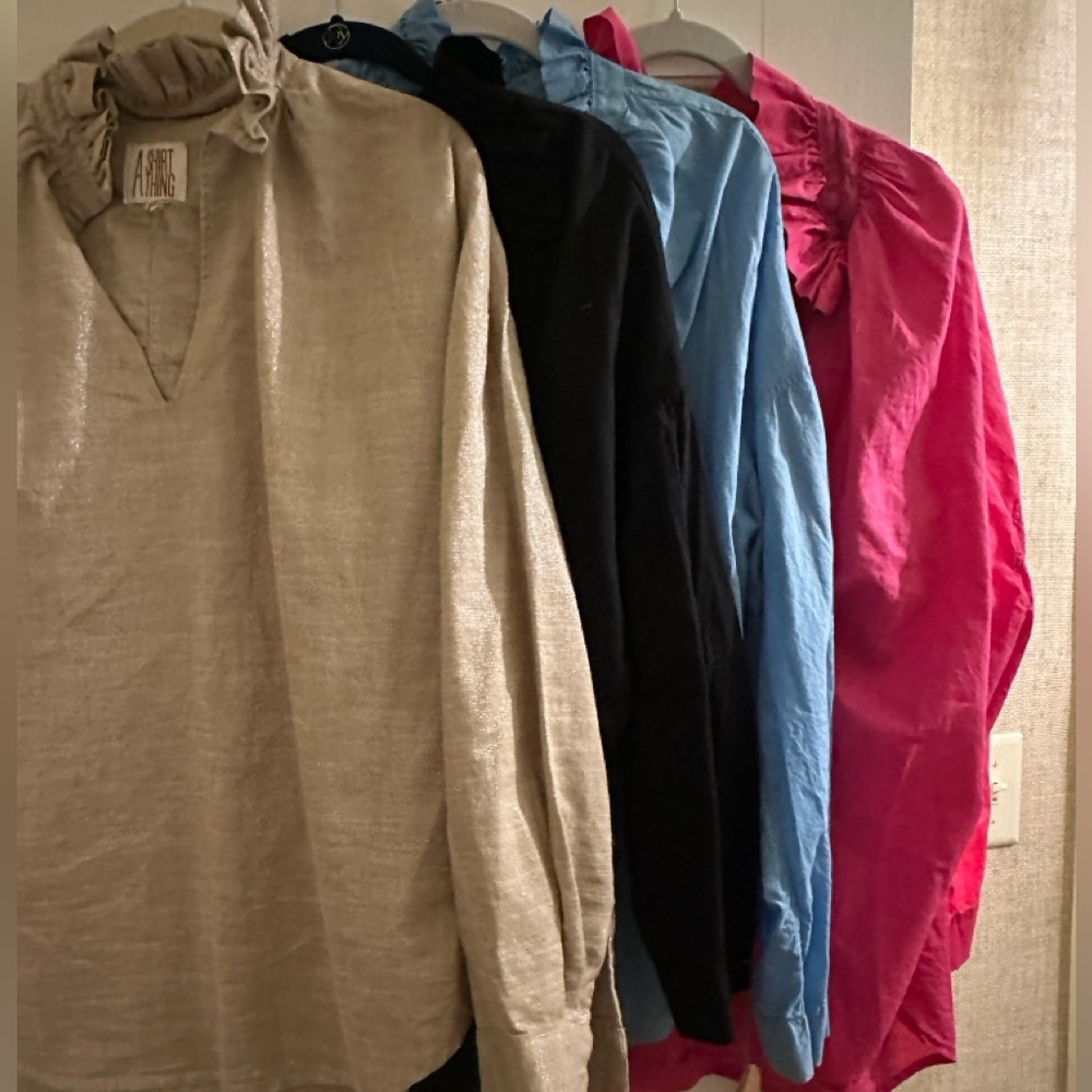 Assortment of Ruffled Blouses in Various Colors
